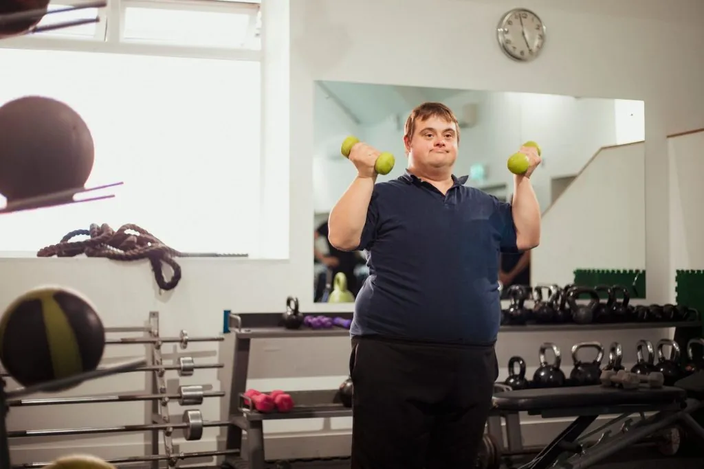 man-with-down-syndrome-lifting-dumbbells