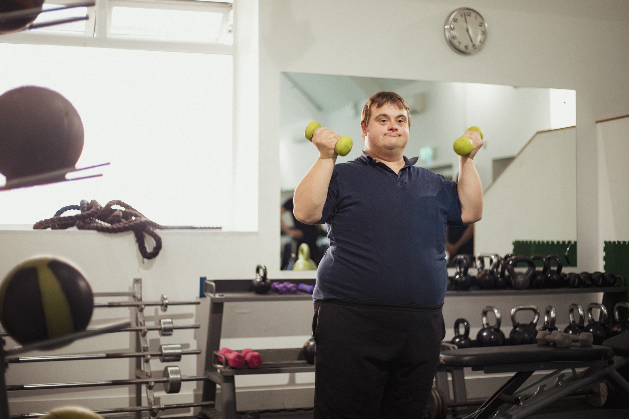 Down Syndrome Male client show casing exercise